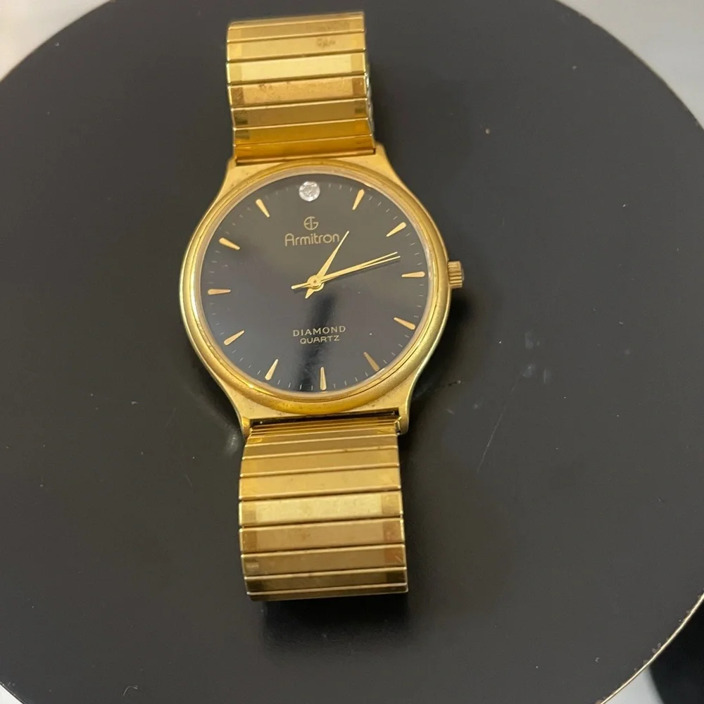 Armitron Gold Tone Watch w/ Black Dial and Single Diamond Accent needs battery